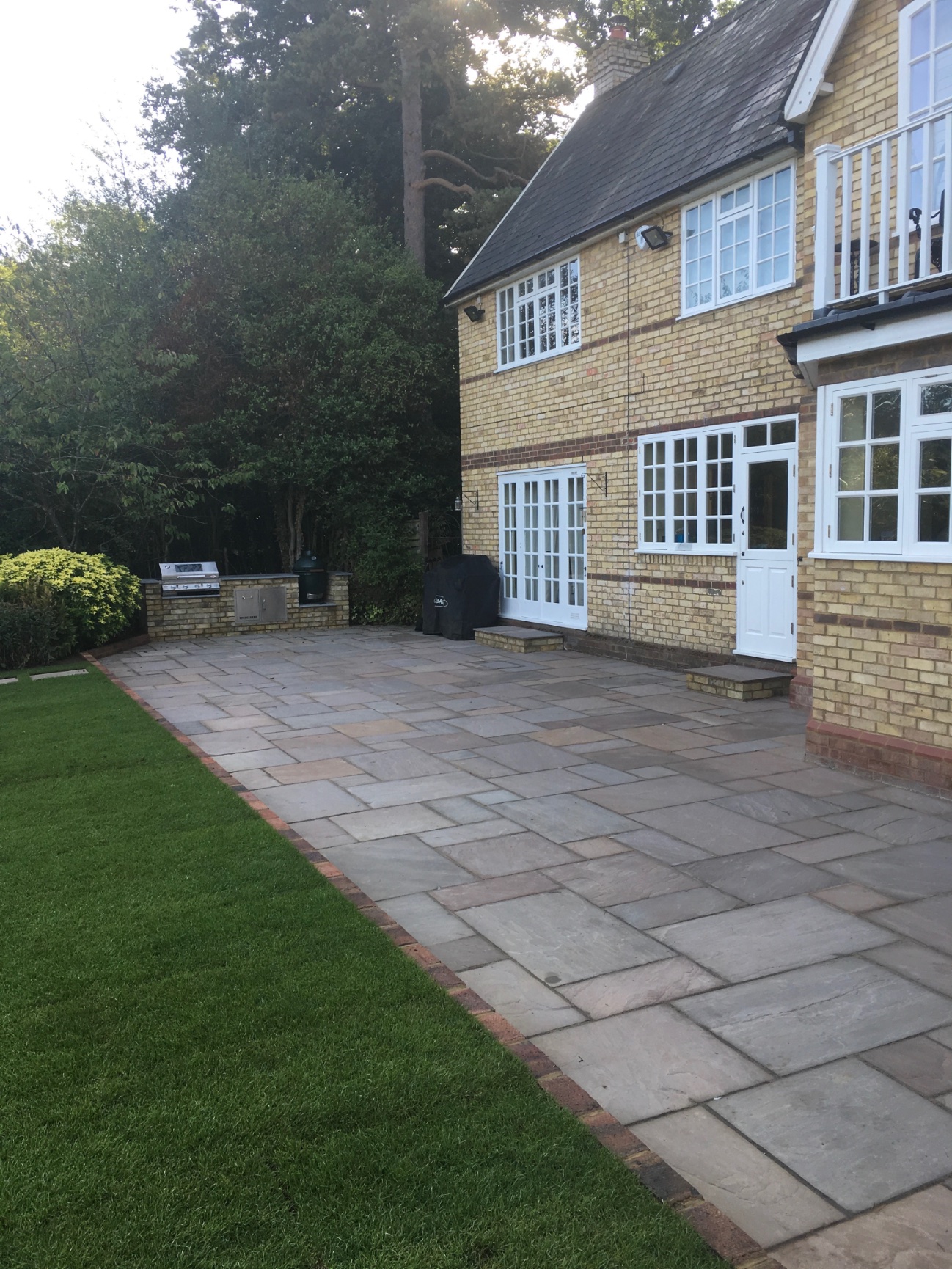 Sandstone patio transformation after