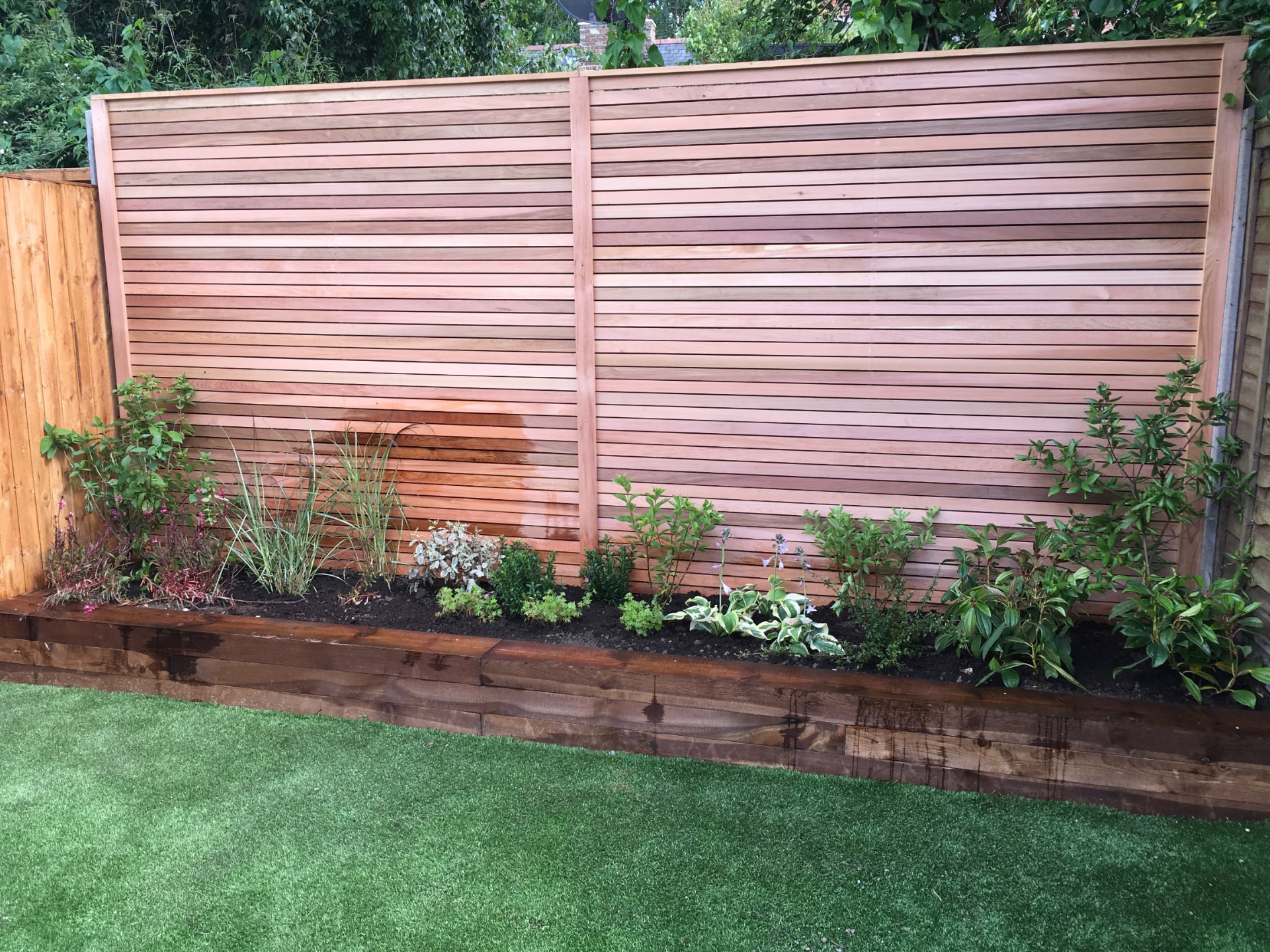 Slatted fence and raised bed