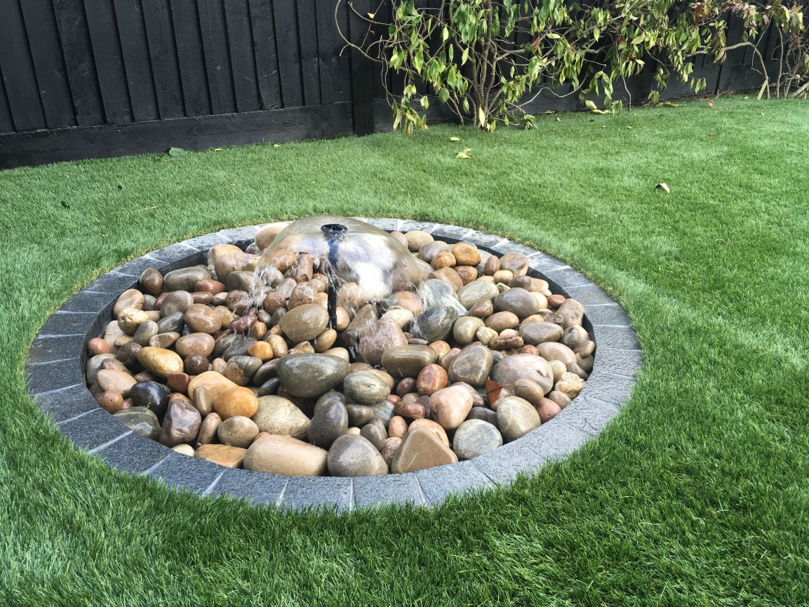 Pebble fountain in lawn