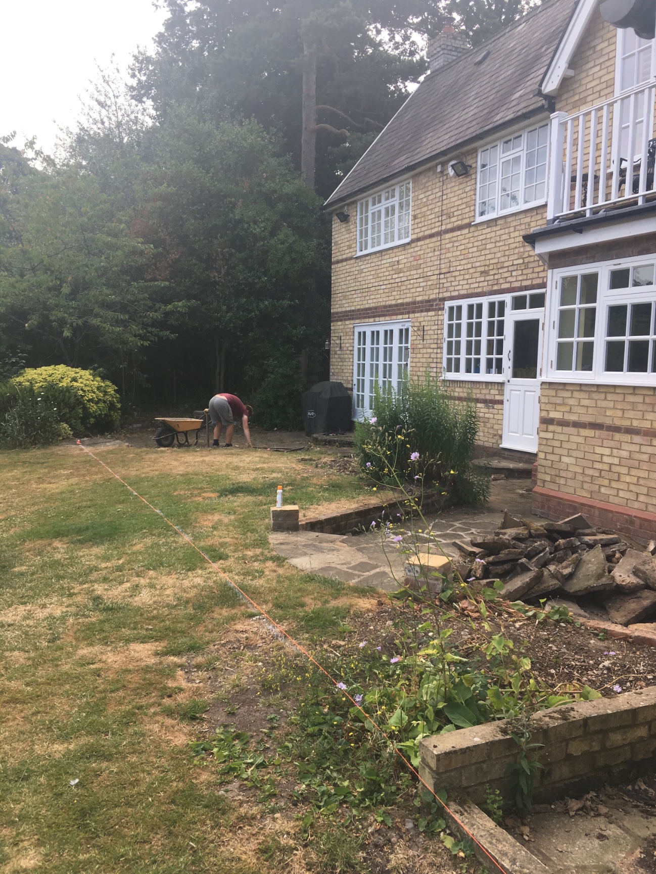 Sandstone patio transformation before